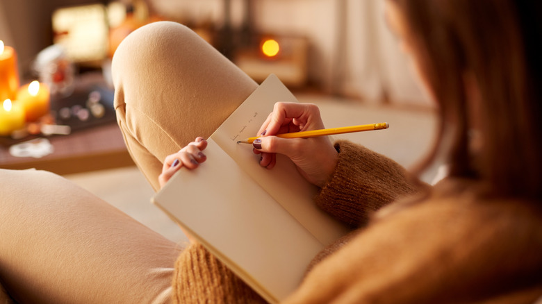 Woman writes in journal