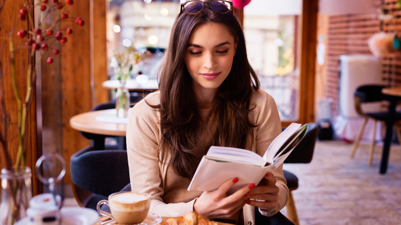 Woman reading in coffee shop