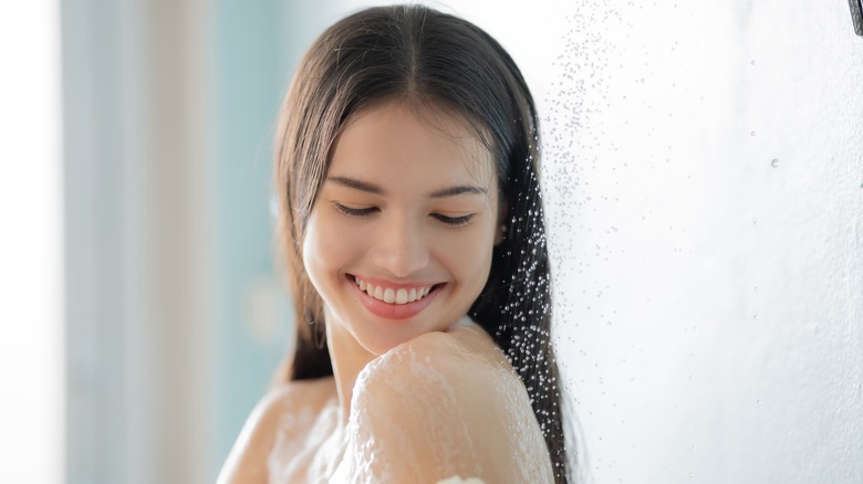 woman applying body wash