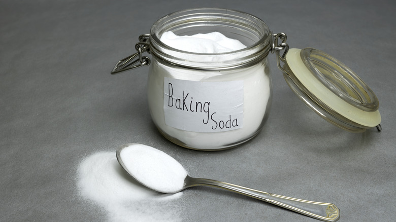 Baking soda in jar with a spoon