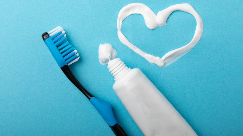 Toothpaste in heart design with toothbrush