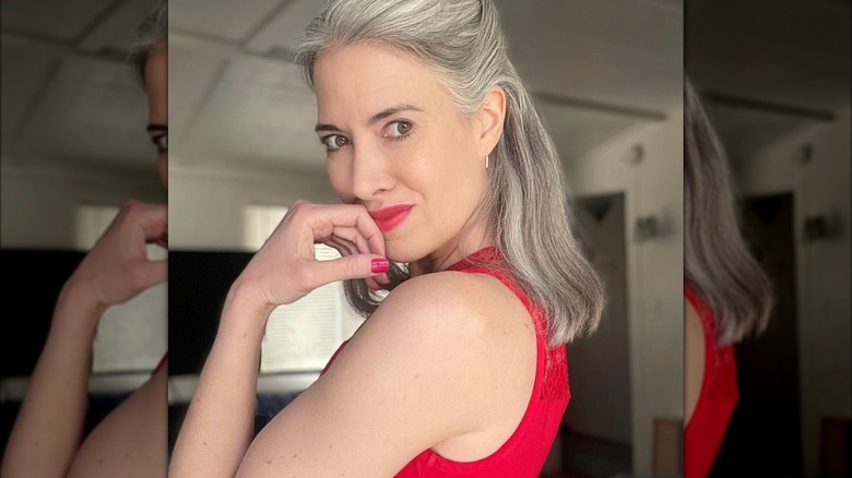 Beautiful gray-haired woman in red