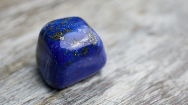 Lapis lazuli stone, grey background 