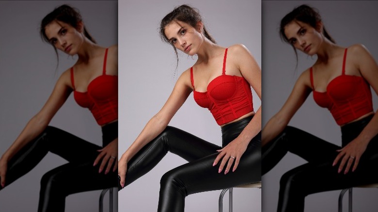 woman wearing red corset top