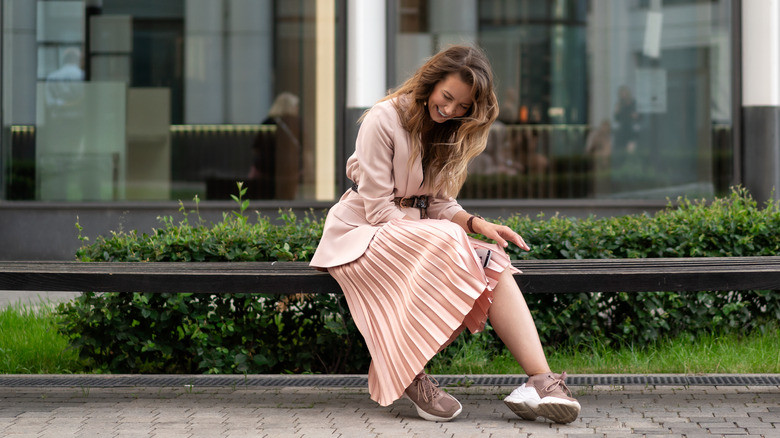 woman wearing pleated skirt