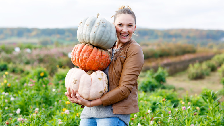 A woman at a pumpkin patch