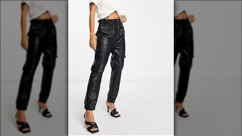 Model wearing leather cargo pants