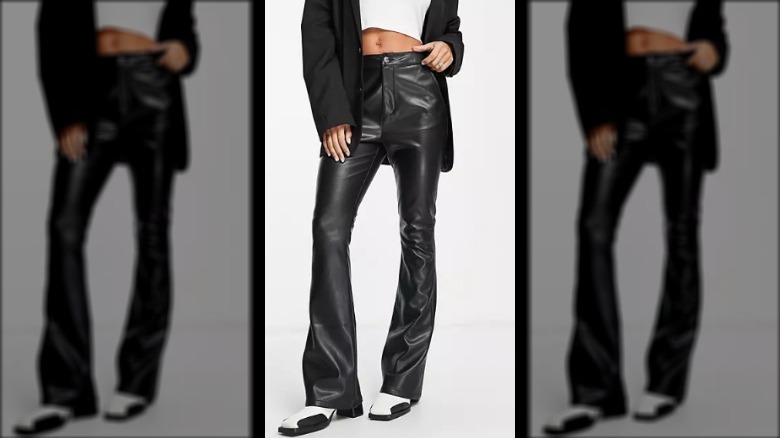 Model wearing flared leather pants