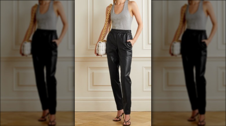 Model wearing faux leather pants