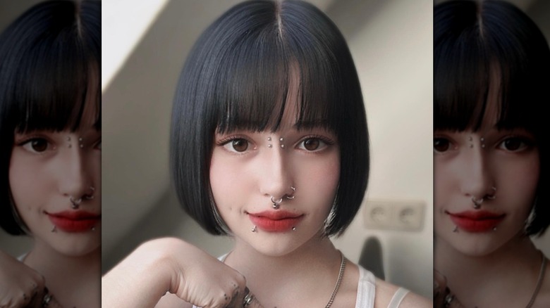 woman with piercings and bangs