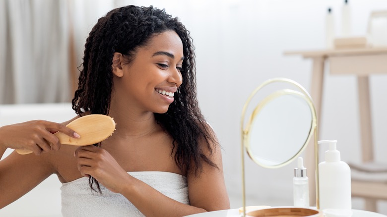 woman combing wet hair