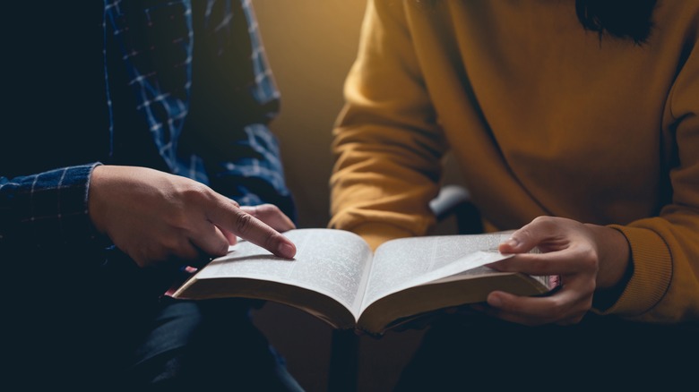 two people reading bible