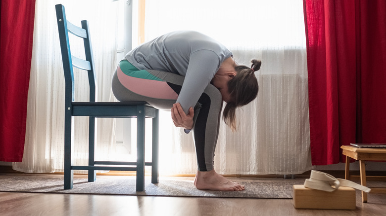 Woman stretching at home 