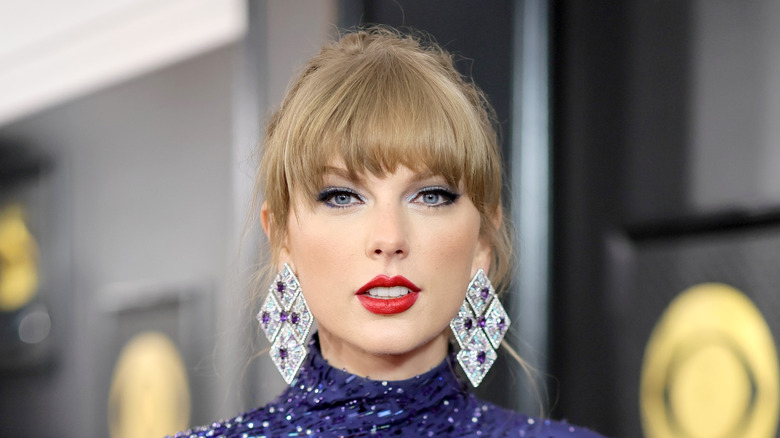 Taylor Swift red lipstick blue jumpsuit