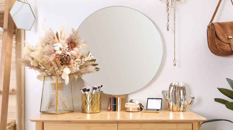 boho styled dresser with floral arrangement 