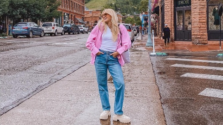 woman wearing Gucci clogs