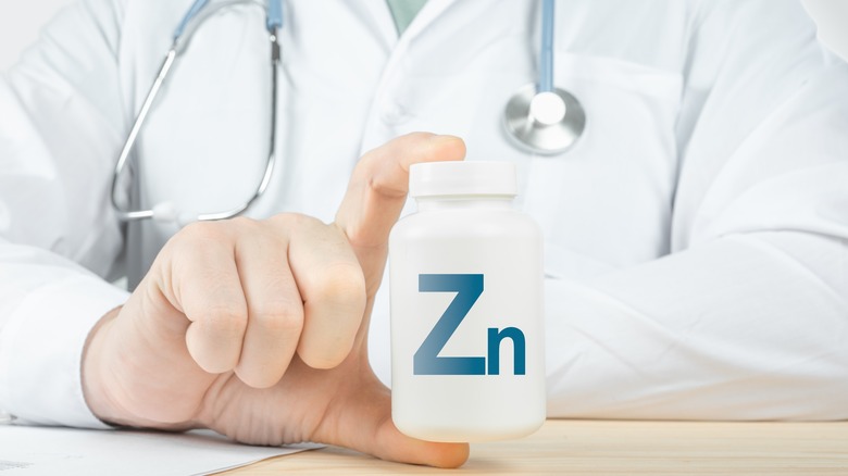 Doctor holding zinc