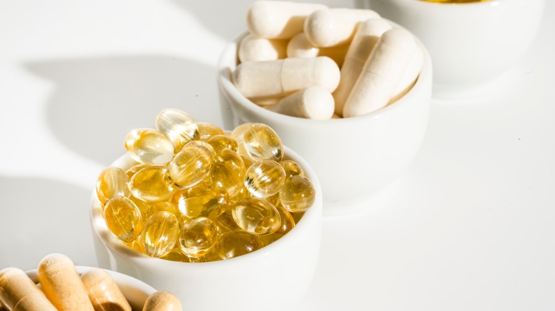 Small bowls containing various supplements