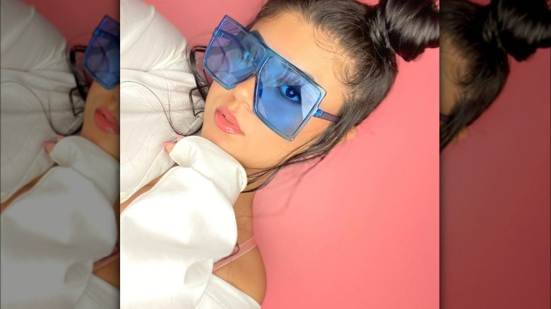 Woman wearing blue sunglasses