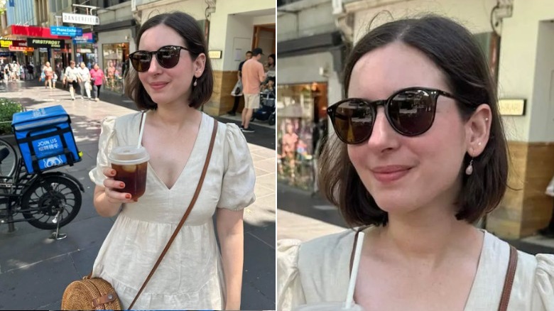 Woman smiles in dress and sunglasses 