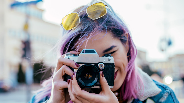 woman taking pictures