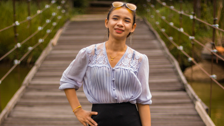 Woman in shirt tucked fully in