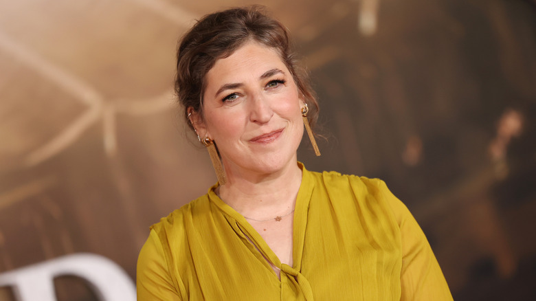 Mayim Bialik in a yellow dress.