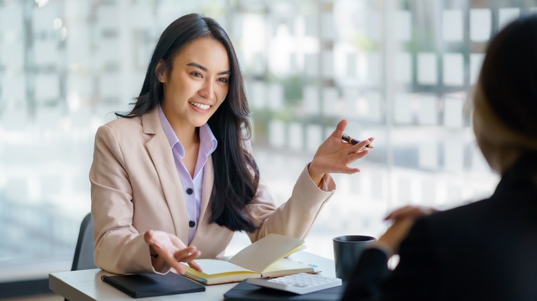 Woman talking to her co-worker