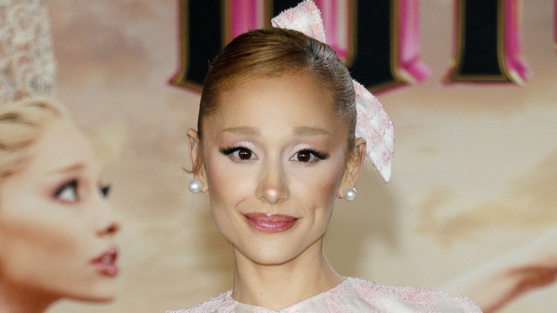 Ariana Grande wearing a pink gingham bow at the Wicked premiere