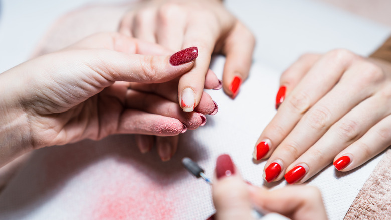 Nail technician using drill