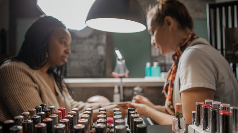 Woman getting manicure