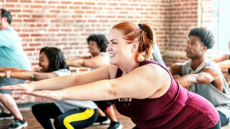 Woman smiling in group workout