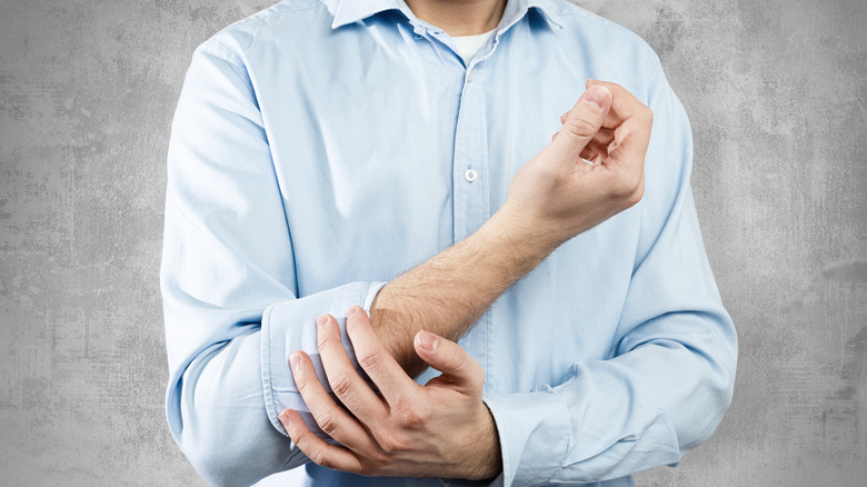 Man rolling up his sleeves