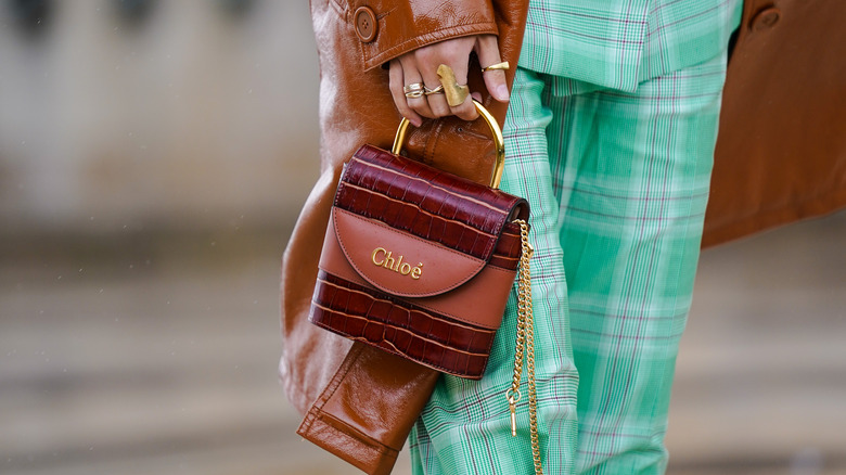 Woman holding red Chloe bag