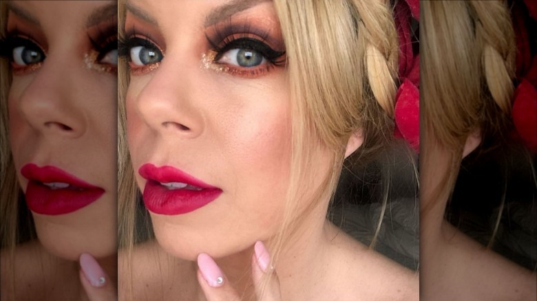Woman with bow lips and eye makeup