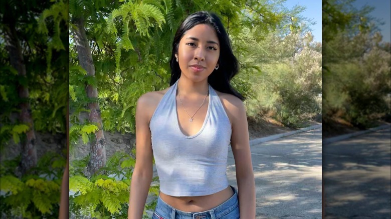 Girl wearing a halter top.