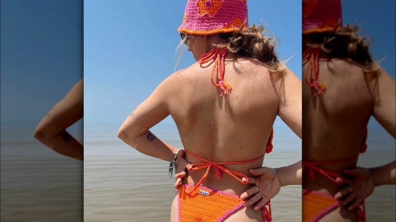 woman wearing matching bucket hat bikini