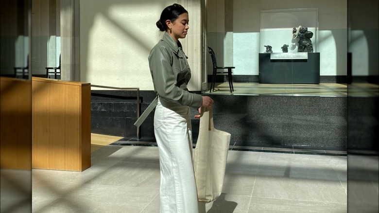 Woman holding canvas bucket tote