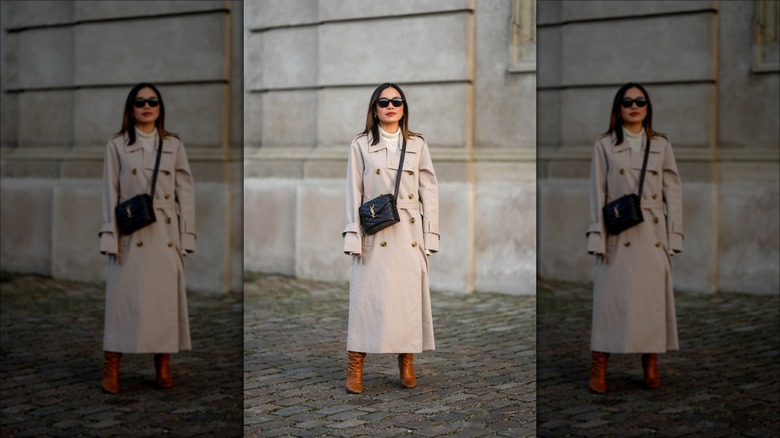 woman wearing camel trenchcoat