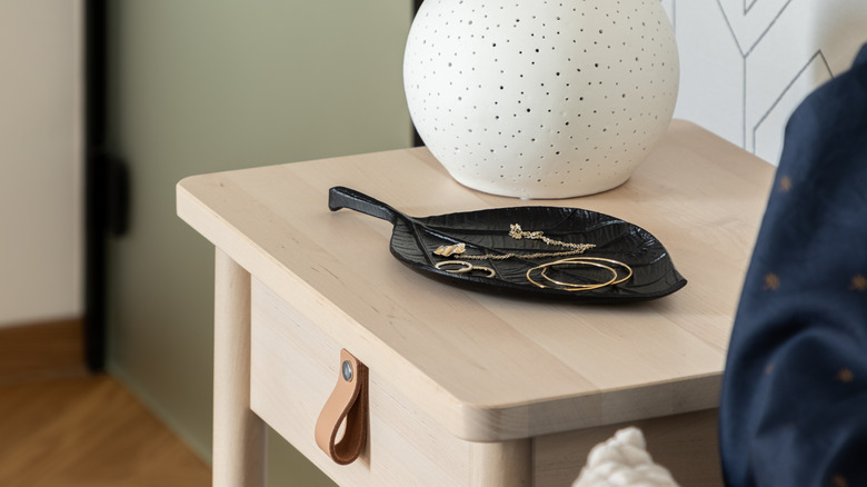 black jewelry dish on nightstand