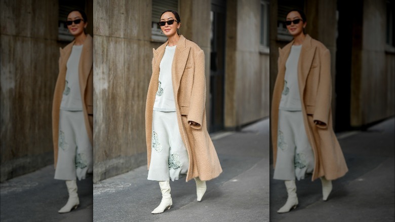 Fashionista posing in a camel coat