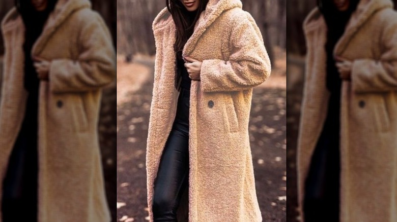 Model wearing a teddy camel coat