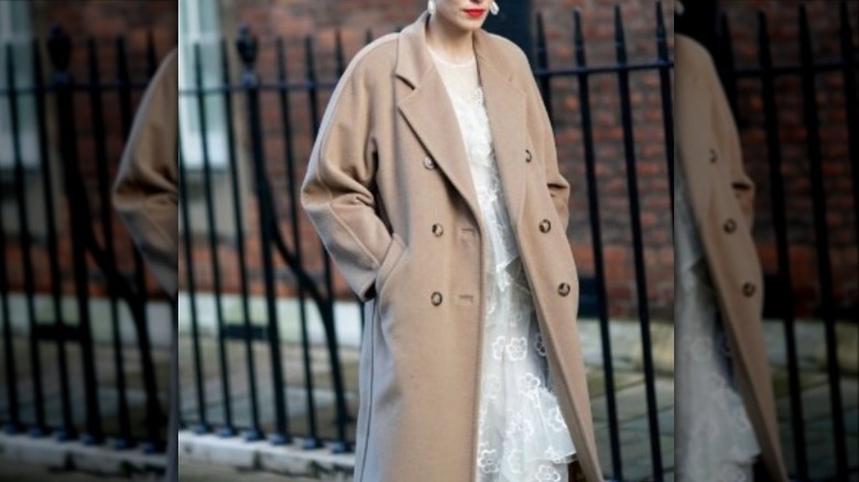 Fashionista in a camel coat and pearls