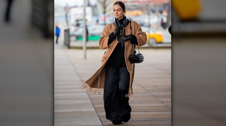 Camel coat over a black outfit