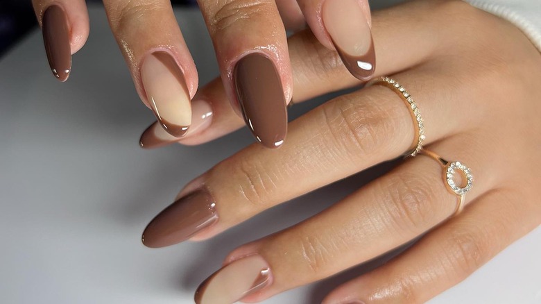 long rounded nails with alternating dark brown tips
