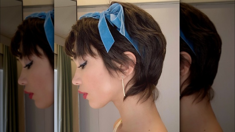 Rowan Blanchard wearing a bow in their Wixie cut.