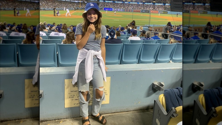 Raegan Revord in a bucket hat at the baseball