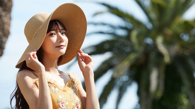 Woman wearing hat in sun