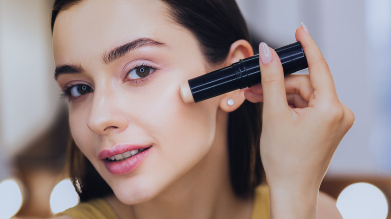 Woman applying contour