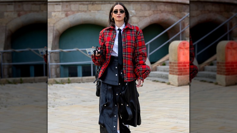 Woman wearing red plaid jacket